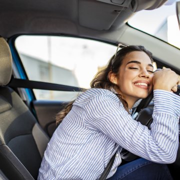 root car insurnace customer reviews car insurance happy woman behind the wheel in the car